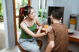 young woman advising stressed man dealing with problems in dining room