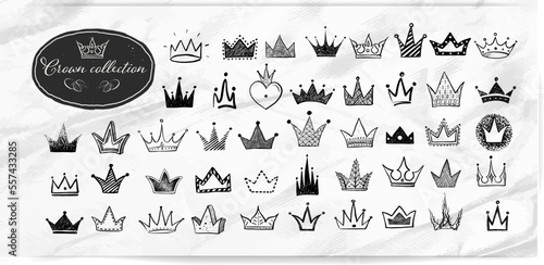 Collection of doodle crowns on old paper background. Vector sketch illustration.