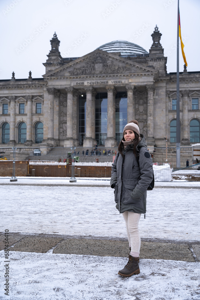 Young woman in front of the German Parliament on her sightseeing tour in Berlin, Germany
