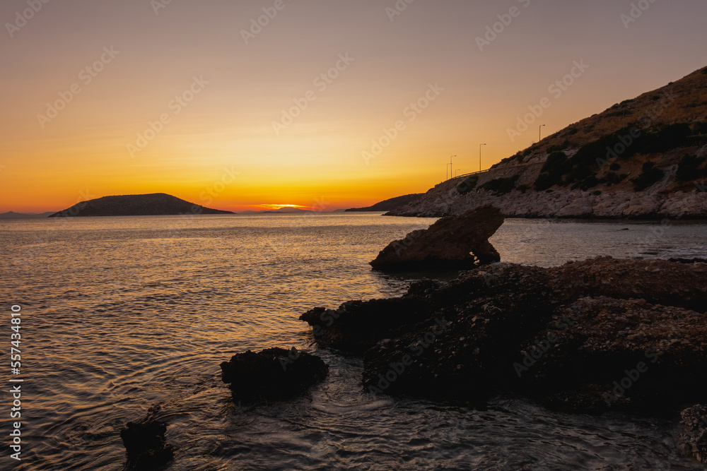 Islands and coast view in greek islands in sunset, rock formation 