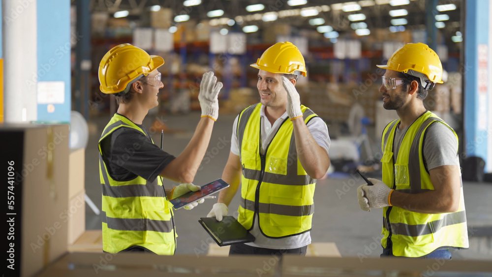 Teamwork of workers working in large warehouse retail store industry.Rack of stock storage. Interior of cargo in ecommerce and logistic concept. Depot. People lifestyle. Shipment service for container Teamwork of workers working in large warehouse retail store industry.Rack of stock storage. Interior of cargo in ecommerce and logistic concept. Depot. People lifestyle. Shipment service for container