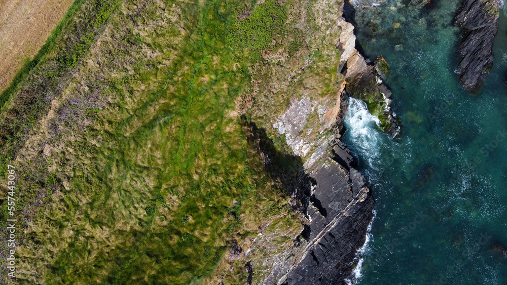 Grassy cliffs on the Atlantic coast. Landscape of Ireland from a height. Seaside rocks. Grassy cliffs on the Atlantic coast. Landscape of Ireland from a height. Seaside rocks.