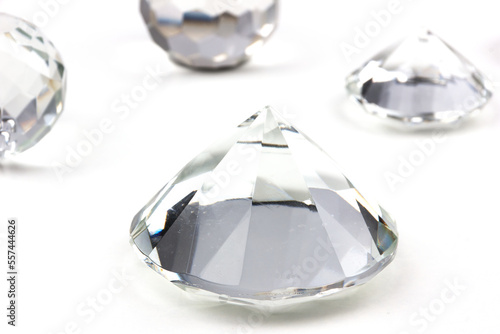 real glas objects with shadows formed as diamond isolated on white background