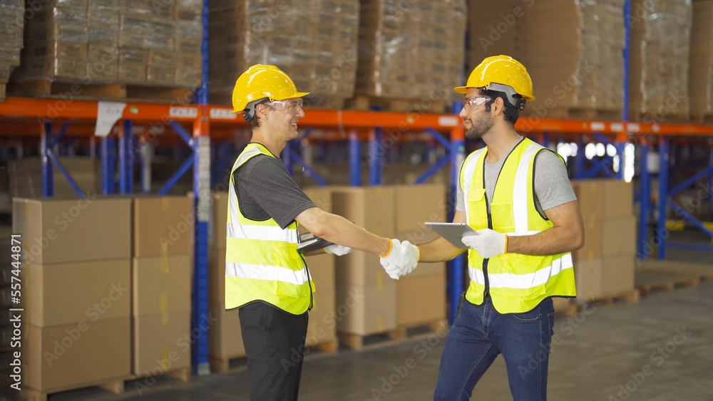 Teamwork of workers working in large warehouse retail store industry.Rack of stock storage. Interior of cargo in ecommerce and logistic concept. Depot. People lifestyle. Shipment service for container Teamwork of workers working in large warehouse retail store industry.Rack of stock storage. Interior of cargo in ecommerce and logistic concept. Depot. People lifestyle. Shipment service for container