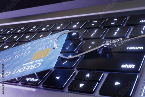 Credit card on a laptop is being stolen by a fish hook. Illustration of the concept of email and phone phishing and internet scams 