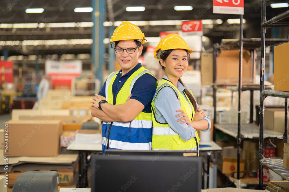 Teamwork group of Asian man worker working in large warehouse retail store industry factory. Rack of stock storage. Cargo in ecommerce and logistic concept. Depot. People lifestyle. Shipment service. Teamwork group of Asian man worker working in large warehouse retail store industry factory. Rack of stock storage. Cargo in ecommerce and logistic concept. Depot. People lifestyle. Shipment service.