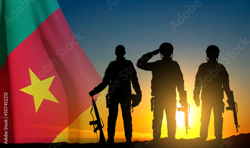 Silhouette of soldiers on background of sunset with Cameroon flag. Background for National Holidays. EPS10 vector