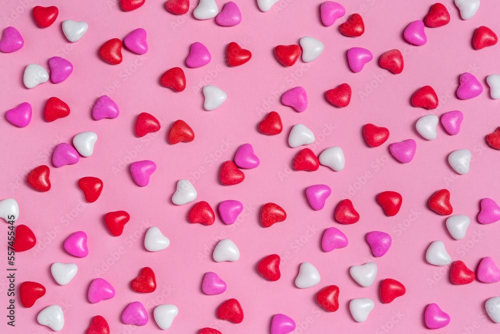 Candy hearts on pink background. Valentine's day. Holiday background
