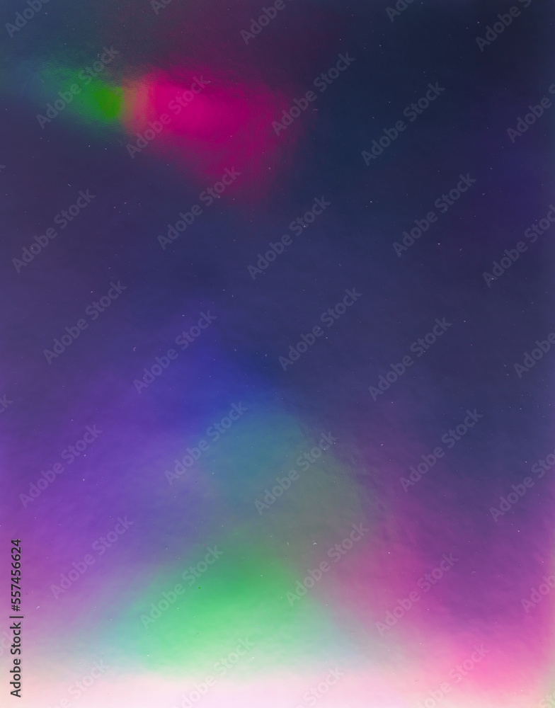 Obraz premium abstract pastel iridescent holographic plastic foil background with light leaks. holo color material. cool glitter surface with shiny rainbow feel.