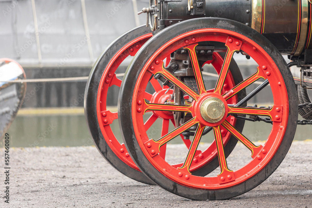 old traction engine with decrative bright red wheels