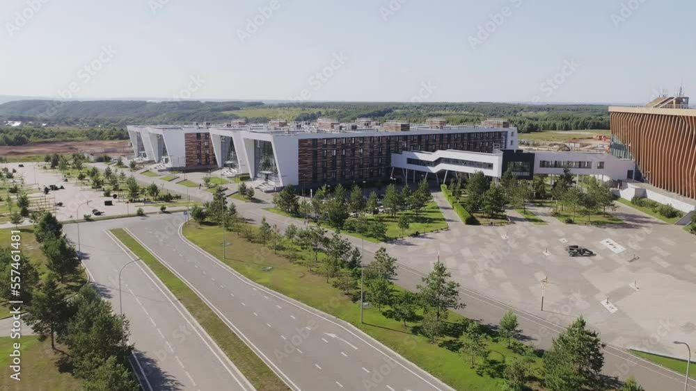 Modern buildings of business center at suburban site on sunny day aerial view. Large educational complex architecture Modern buildings of business center at suburban site on sunny day aerial view. Large educational complex architecture