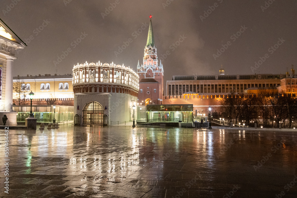 Moscow, Russia - December 27, 2022: Tower of the Moscow Kremlin. Cold and deserted Moscow street on a snowy winter evening near Red Square