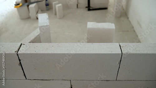 Photos A construction site on which the walls are built of aerated concrete bricks