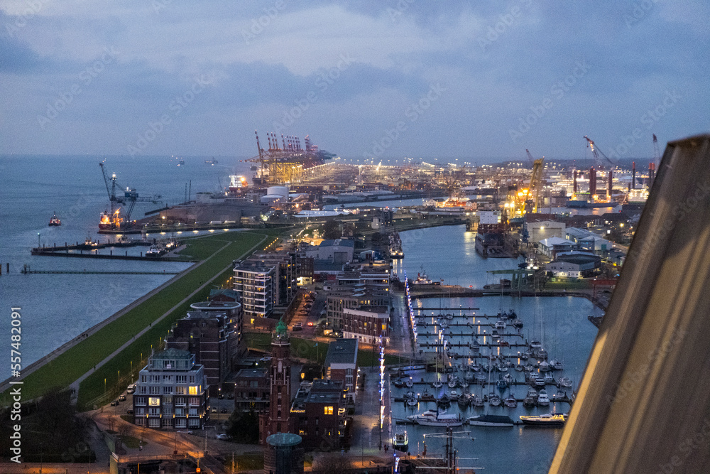 Sunset in Bremerhaven with houses and ships and the (bremer Schiffahrts-Museum), Klimahaus and the coast line of Bremerhaven (technik museum) taken from 90 m high bulding, Monochrom, sepia, panorama