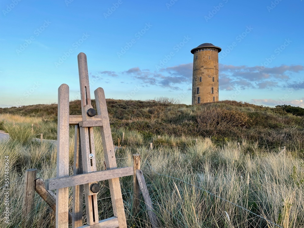 Easel with View to a Tower in the Dunes