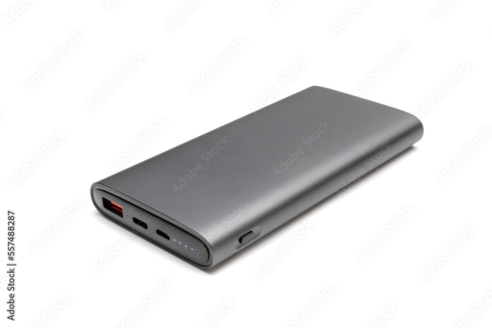 Fully charged portable powerbank with two usb outputs isolated on a white background. Powerbank for charging mobile devices. Fully charged portable powerbank with two usb outputs isolated on a white background. Powerbank for charging mobile devices.