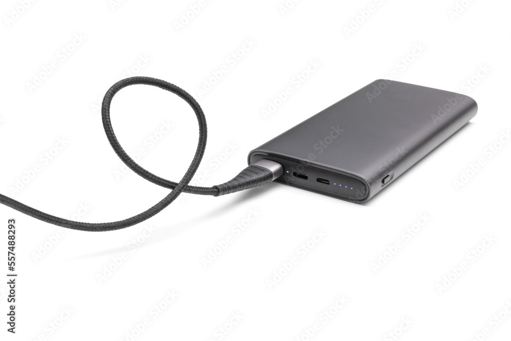Fully charged portable powerbank with two usb outputs isolated on a white background. Powerbank for charging mobile devices. Fully charged portable powerbank with two usb outputs isolated on a white background. Powerbank for charging mobile devices.