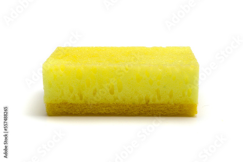 Single yellow kitchen sponge isolated on white background, closeup side view