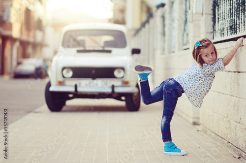 Little girl dancing on the street