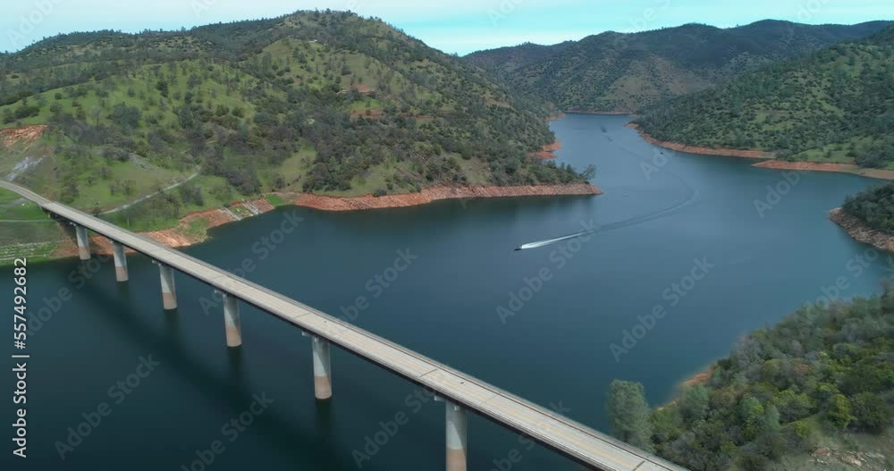 Aerial: Flying Over Don Pedro Reservoir Lake and highway. California, USA Aerial: Flying Over Don Pedro Reservoir Lake and highway. California, USA