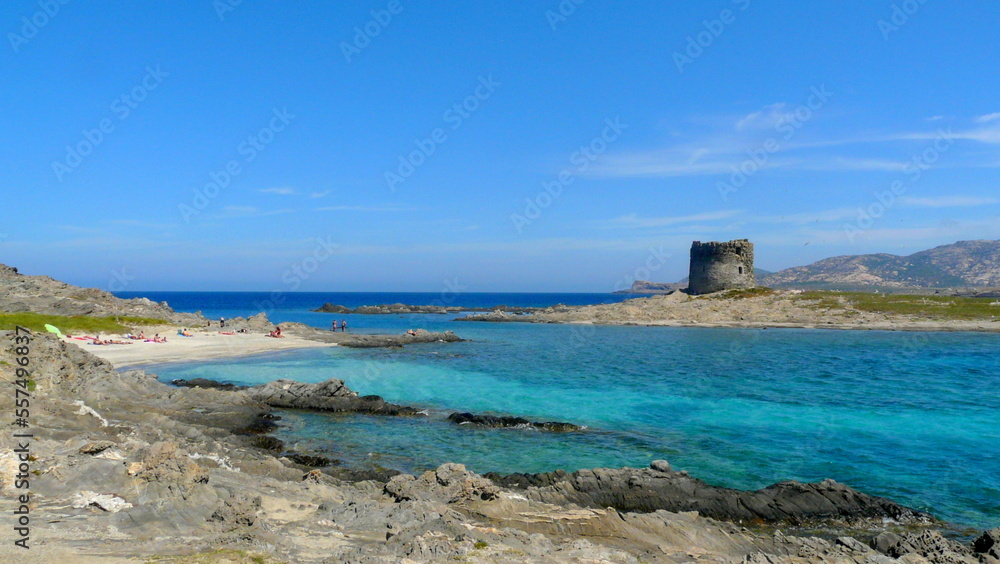 View of wonderful Pelosa beach with an ancient medieval tower on an isolated beach, Sardinia, Italy View of wonderful Pelosa beach with an ancient medieval tower on an isolated beach, Sardinia, Italy