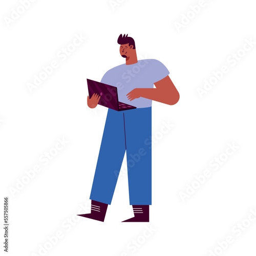 man standing using laptop