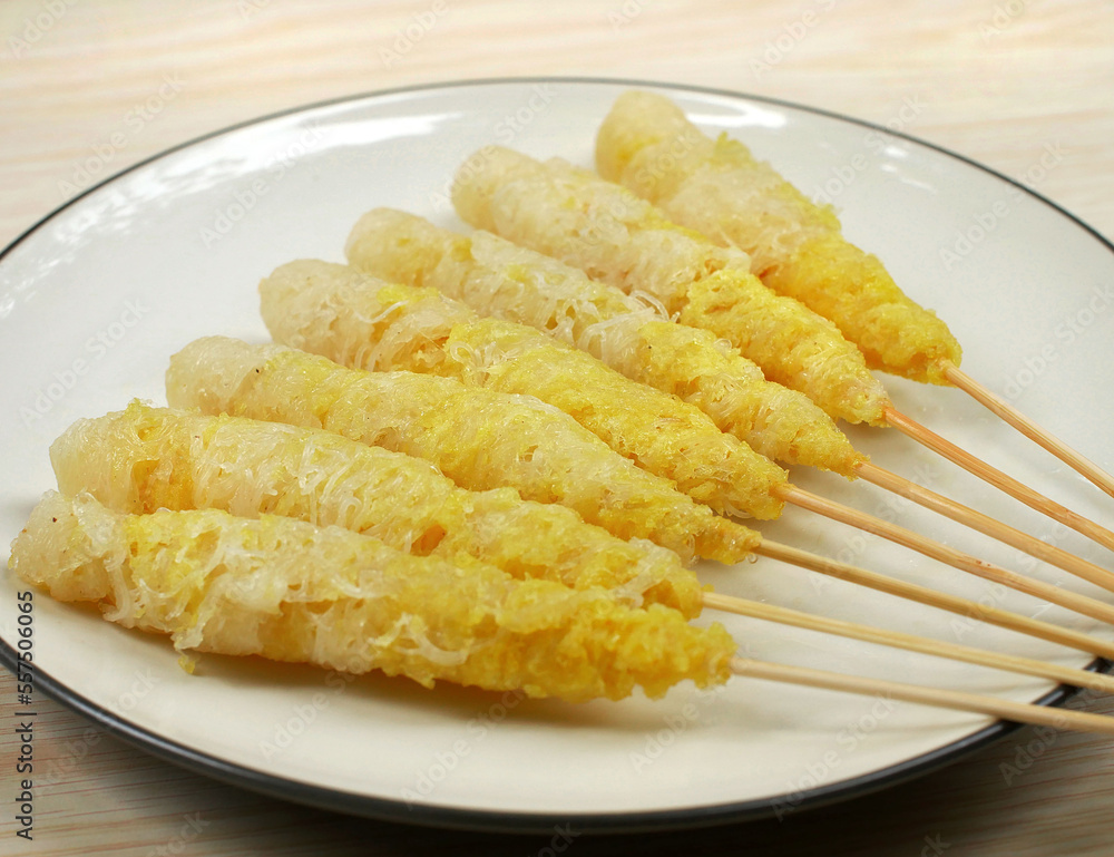 Telor gulung ( egg rolls ) indonesia street food in white plate. Telor gulung ( egg rolls ) indonesia street food in white plate.
