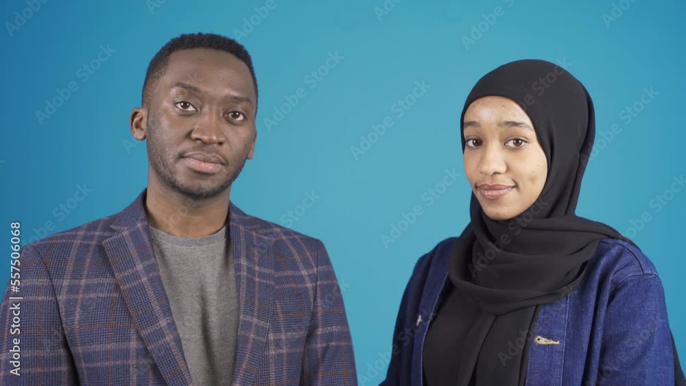 Portrait of African young Muslim man and African Muslim young woman.
Muslim African young man and young African woman in hijab looking at camera. African Muslims.
Portrait of African young Muslim man and African Muslim young woman.
Muslim African young man and young African woman in hijab looking at camera. African Muslims.