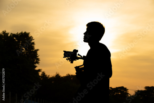 photo of Cameraman silhouette at sunset