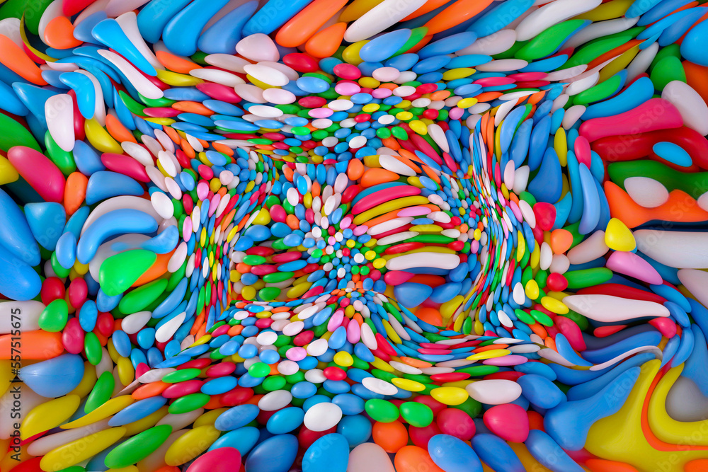 Multi colored, highly saturated plastic balls, in soft play ball pit, at a child's play park. Colorful balloon easter day concept.