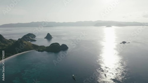 Aerial top view of a traditional boat in beautiful sea bay with turquoise crystal clear water, 