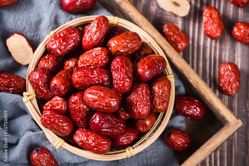 Photos jujube,dried red dates on wooden table.