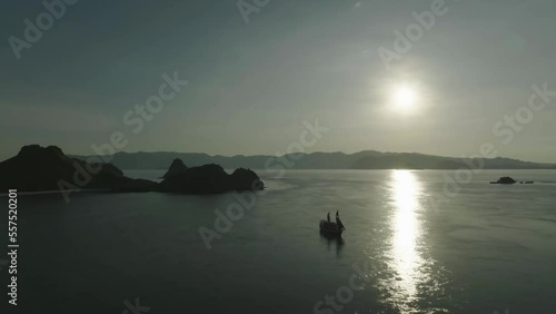 Aerial top view of a traditional boat in beautiful sea bay with turquoise crystal clear water, 