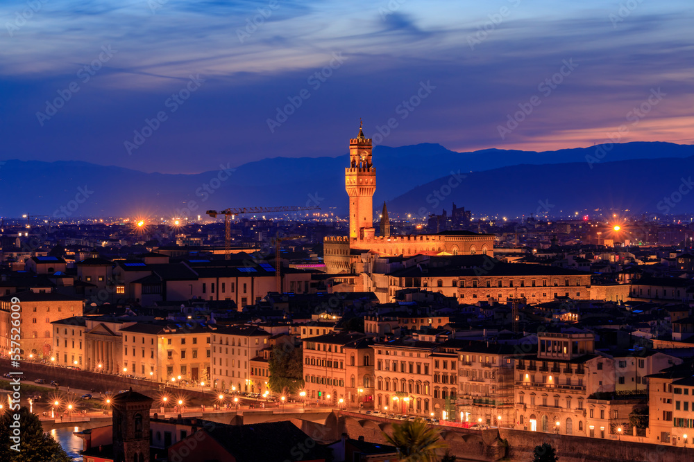 Sunset view of the Palazzo Vecchio Tower and Florence cityscape, at night, Italy