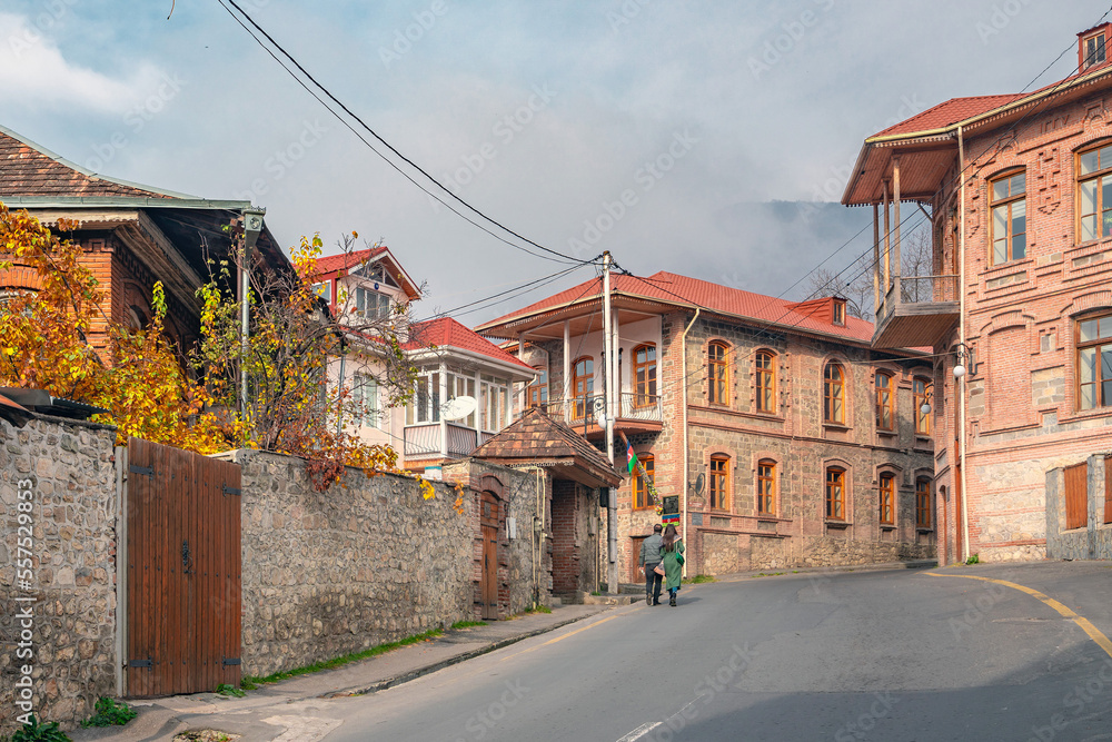 Shaki, Azerbaijan, November 27, 2022. Tourists walk along the old streets