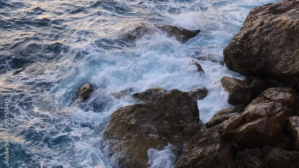 Sea waves breaking on rocks on the coastline and the seagulls flying near, nature footage 4k. Sea waves breaking on rocks on the coastline and the seagulls flying near, nature footage 4k.