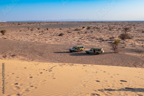 Scenic view of tourist safari jeeps seen from North Sand Dune in Marsabit, Kenya