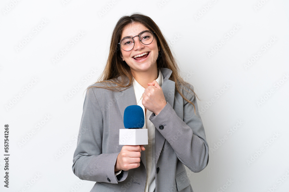 Young caucasian TV presenter woman isolated on white background celebrating a victory Young caucasian TV presenter woman isolated on white background celebrating a victory