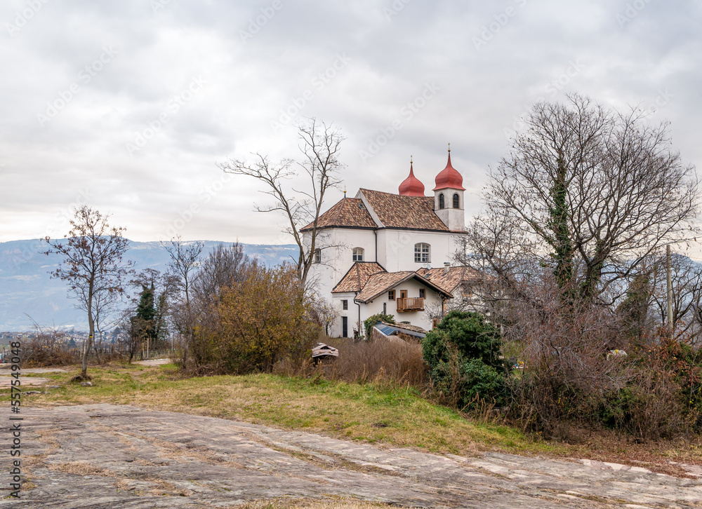 Obraz premium Calvary church of the Holy Cross above Saint Michael- Eppan (San Michele Appiano), Bolzano province, Trentino Alto Adige, South Tyrol, December 30, 2022
