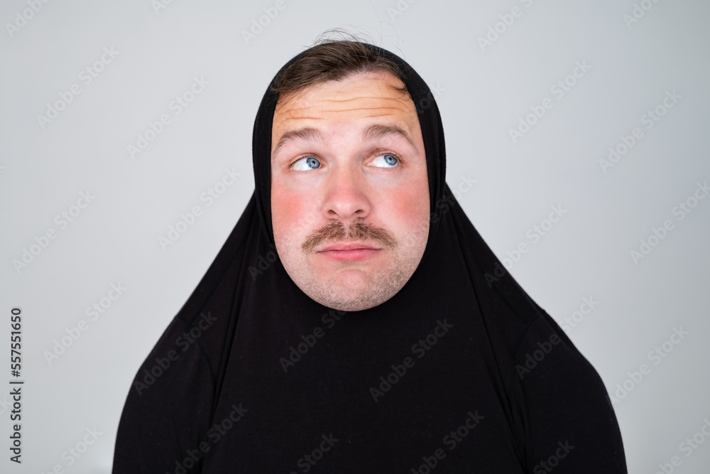 Funny caucasian man covering head with sweater smiling cheerful and funny. Funny caucasian man covering head with sweater smiling cheerful and funny.