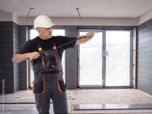 Man electrician. Builder wi...