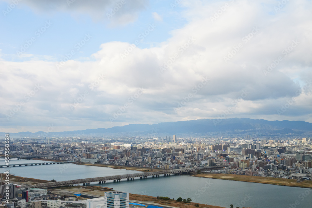 Overhead view of Osaka's Umeda area from a hill on a cloudy day