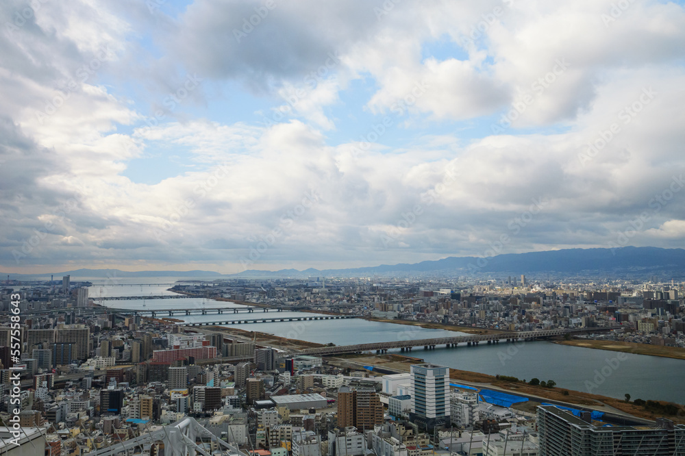 Overhead view of Osaka's Umeda area from a hill on a cloudy day