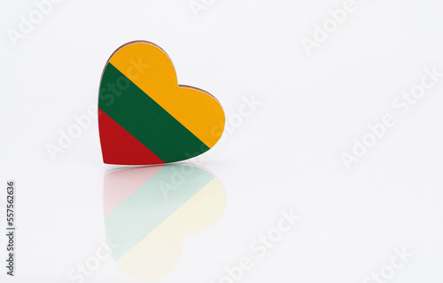 Flag of Lithuania in the shape of a heart on a white background. The concept of patriotism. copy space.