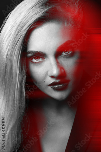 Beautiful woman with long hair close-up studio fashion portrait in RGB color split. RGB effect make reflection of model face in red color. Abstract and futuristic looking style