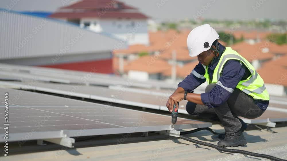 Engineer on rooftop sitting next to solar panels photo voltaic check alignment for good installation
Engineer on rooftop sitting next to solar panels photo voltaic check alignment for good installation