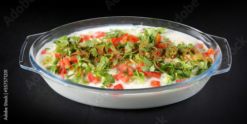 yoghurt garnished with green vegetable Indian style 