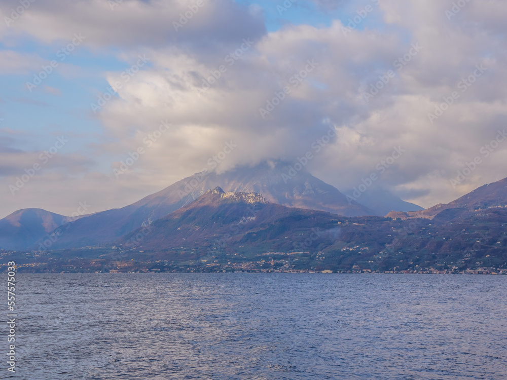 View of Lake Garda with mountains with clouds