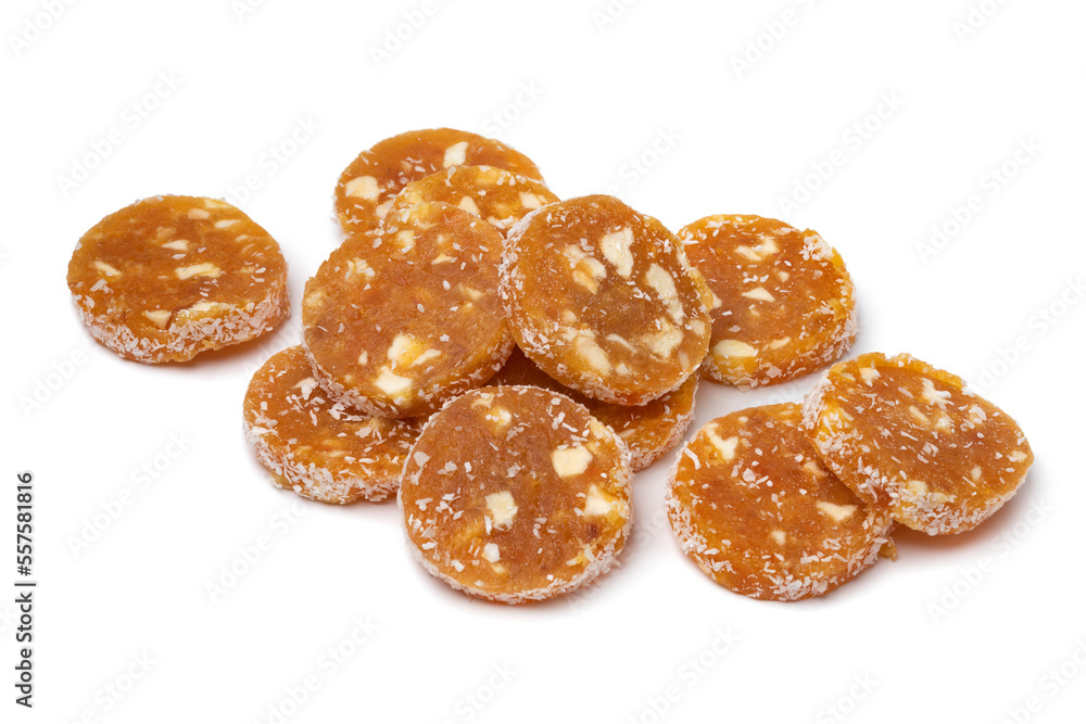 Heap of slices energy food, ground dried apricot, nuts and coconut isolated on white background