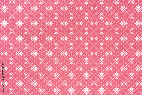 holiday themed scrapbook paper background: white snowflake pattern on red